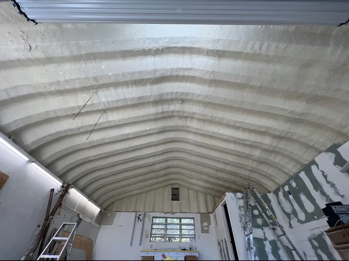 Spray polyurethane foam applied to the underside of a metal roof deck in Boulder City